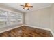 Bedroom featuring hardwood floors, a ceiling fan, and great natural light from windows at 4016 N Seminole Ave, Tampa, FL 33603