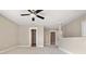 A bright bedroom with a ceiling fan and access to a closet at 4016 N Seminole Ave, Tampa, FL 33603