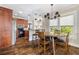 Open dining area featuring pendant lights and hardwood floors at 4016 N Seminole Ave, Tampa, FL 33603