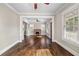 Bright living room with hardwood floors, a brick fireplace, and large windows at 4016 N Seminole Ave, Tampa, FL 33603