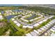 An aerial view of the residential community featuring winding waterways and lush landscaping at 4305 Summersun Dr, New Port Richey, FL 34652