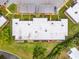 Aerial view shows roof and lawn space, landscaping, patio, and car park of the condo at 4305 Summersun Dr, New Port Richey, FL 34652