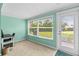 Bedroom features a large window with green walls and carpeted flooring at 4305 Summersun Dr, New Port Richey, FL 34652
