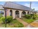 An inviting residence featuring unique architectural details and lush landscaping at 4305 Summersun Dr, New Port Richey, FL 34652