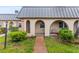 Charming patio area with colorful chairs and garden view at 4305 Summersun Dr, New Port Richey, FL 34652