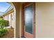 Inviting front door with decorative glass and neutral colored walls in a sunny location at 4305 Summersun Dr, New Port Richey, FL 34652