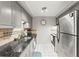 Modern kitchen with stainless steel appliances and granite countertops at 4305 Summersun Dr, New Port Richey, FL 34652