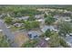 An aerial shot of a residential area with a single-story home featuring solar panels at 4623 Wisteria Dr, Zephyrhills, FL 33542