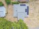 An aerial view of a home, highlighting its roof with solar panels at 4623 Wisteria Dr, Zephyrhills, FL 33542