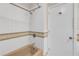 Bathroom featuring a combination tub and shower with white tiled walls and a stylish decorative band at 4623 Wisteria Dr, Zephyrhills, FL 33542