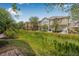 Townhomes with a patio surrounded by lush greenery and grass at 5176 6Th N St, St Petersburg, FL 33703