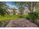 Townhomes with a brick paver patio surrounded by lush greenery at 5176 6Th N St, St Petersburg, FL 33703