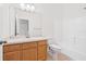 Bathroom with a wood vanity and a shower-tub combo at 5176 6Th N St, St Petersburg, FL 33703
