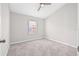 Bedroom with neutral carpet and one window at 5176 6Th N St, St Petersburg, FL 33703