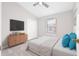 Bedroom with closet, ceiling fan, carpet, window with blinds, bed, and nightstand at 5176 6Th N St, St Petersburg, FL 33703