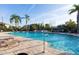 Resort-style community pool with ample seating, lush landscaping, and a clear blue swimming area at 5176 6Th N St, St Petersburg, FL 33703
