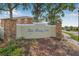 Bay Breeze Cove community sign with stacked stone columns and beautiful landscaping on a sunny day at 5176 6Th N St, St Petersburg, FL 33703