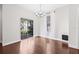 Bright dining room with hardwood floors, chandelier, and a sliding door, creating an inviting atmosphere for meals at 5176 6Th N St, St Petersburg, FL 33703