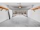Spacious garage with overhead storage racks at 5176 6Th N St, St Petersburg, FL 33703