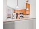 A kitchen with stainless steel appliances and wood cabinets, creating a functional and modern cooking space at 5176 6Th N St, St Petersburg, FL 33703