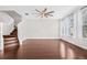 Bright living room featuring wood floors, large windows, and a ceiling fan at 5176 6Th N St, St Petersburg, FL 33703