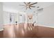 Open-concept living space with hardwood floors, staircase, and a glimpse of the kitchen, offering a modern layout at 5176 6Th N St, St Petersburg, FL 33703