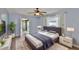 Cozy bedroom featuring a plush bed, bedside tables, and natural light from the window at 5219 4Th S St, St Petersburg, FL 33705