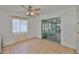 An empty dining room with tile flooring and a ceiling fan with access to the lanai at 5219 4Th S St, St Petersburg, FL 33705