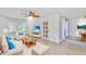 Bright living room with hardwood floors, ceiling fan, and comfortable seating at 5219 4Th S St, St Petersburg, FL 33705