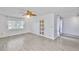 Open living room with hardwood floors, a ceiling fan, and neutral paint at 5219 4Th S St, St Petersburg, FL 33705