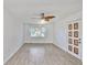 Bright and open living area with a fan and a view of the landscaped exterior at 5219 4Th S St, St Petersburg, FL 33705