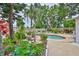 Landscaped backyard showcasing a sparkling pool with lounge chairs at 5219 4Th S St, St Petersburg, FL 33705