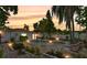 Outdoor pool and backyard lounge area provide a relaxing space for enjoying evenings at home at 5219 4Th S St, St Petersburg, FL 33705