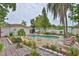 Backyard with a refreshing pool surrounded by comfortable lounge chairs at 5219 4Th S St, St Petersburg, FL 33705