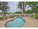 Backyard features a refreshing pool with surrounding patio and seating at 5219 4Th S St, St Petersburg, FL 33705