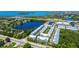Aerial view of townhome community with lake, marina, and convenient highway access at 6140 Marina Cove S Way, St Petersburg, FL 33712