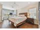 Bright bedroom with hardwood floors, ceiling fan, and large windows for natural light at 6140 Marina Cove S Way, St Petersburg, FL 33712