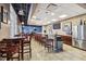 Common area with bar, lots of chairs, tables, and views from the windows at 6140 Marina Cove S Way, St Petersburg, FL 33712