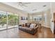 Inviting living room with sliding glass doors to the balcony offering natural light at 6140 Marina Cove S Way, St Petersburg, FL 33712