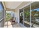 Relax on the screened porch with cozy rocking chairs and views of lush greenery and easy access to indoor at 6140 Marina Cove S Way, St Petersburg, FL 33712