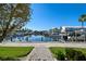 Scenic water view with boat docks, palm trees, and surrounding neighborhood, offering serene waterfront living at 6140 Marina Cove S Way, St Petersburg, FL 33712