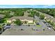 Aerial view of community with lush trees and multiple buildings at 6250 Maisie Rd, Zephyrhills, FL 33542