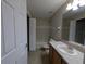 Bathroom featuring tile flooring, single sink vanity, and combined shower-tub at 6250 Maisie Rd, Zephyrhills, FL 33542