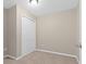 Neutral bedroom featuring carpet, and a standard closet with bifold doors at 6250 Maisie Rd, Zephyrhills, FL 33542