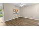 Open dining area featuring wood-look flooring and ceiling fan at 6250 Maisie Rd, Zephyrhills, FL 33542
