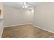 Cozy dining area with wood-look flooring, a ceiling fan, and access to the kitchen at 6250 Maisie Rd, Zephyrhills, FL 33542