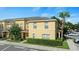 View of exterior home with a tropical palm tree and parking at 6250 Maisie Rd, Zephyrhills, FL 33542