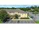 Exterior of a sunny two-story home with parking spaces at 6250 Maisie Rd, Zephyrhills, FL 33542