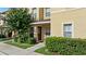 Inviting townhome exterior with well-maintained landscaping and a charming entrance at 6250 Maisie Rd, Zephyrhills, FL 33542