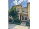 Two-story townhome with neutral exterior, well-maintained landscaping, and sunny curb appeal at 6250 Maisie Rd, Zephyrhills, FL 33542